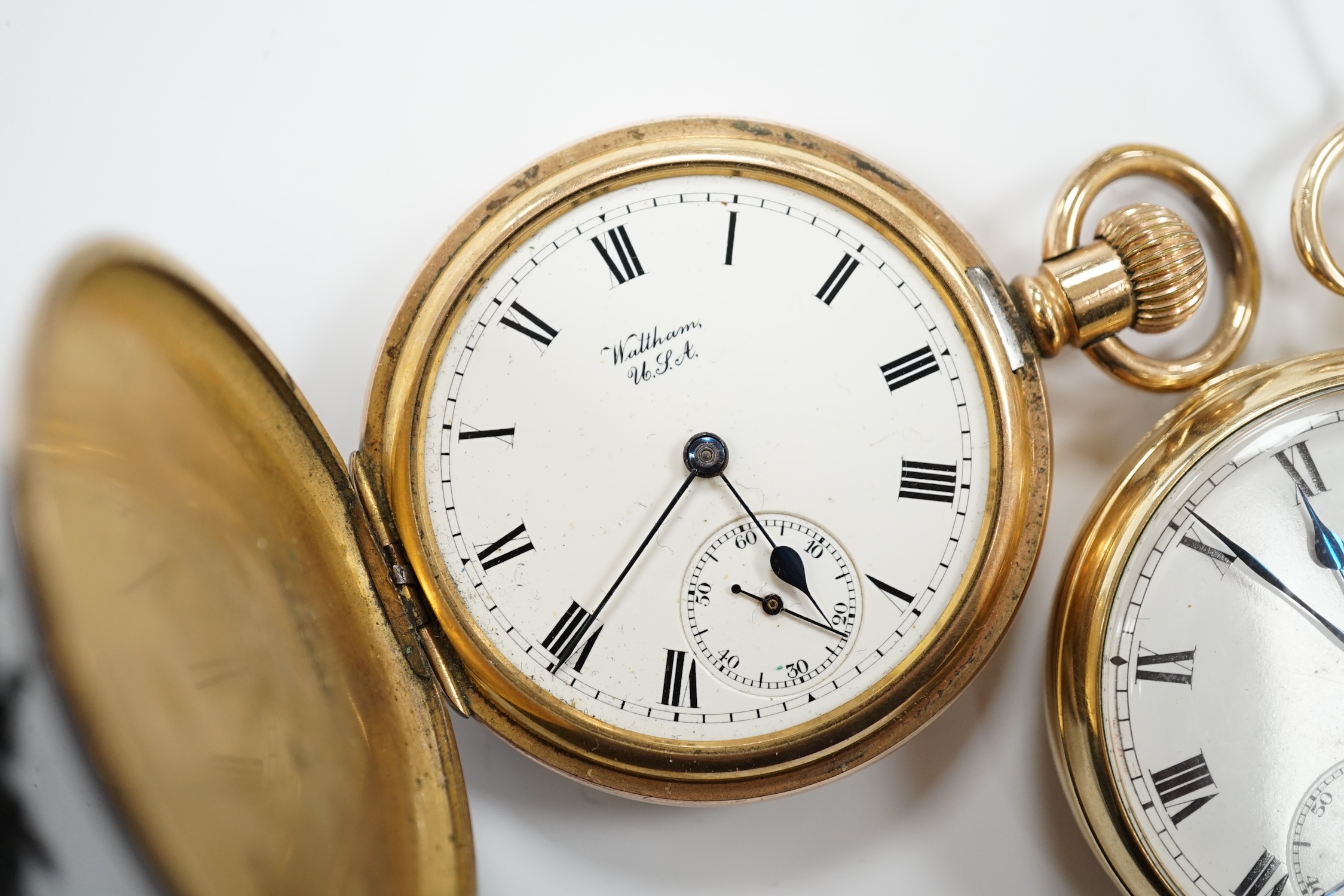 A gold plated Omega open faced pocket watch, with Roman dial and subsidiary seconds and a gold plated Waltham hunter pocket watch.